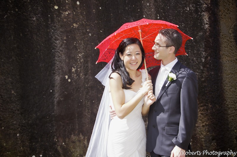 Chinese bride with red umbrella - wedding photography sydney